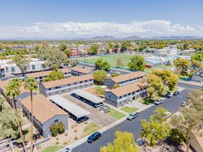 Glendale apartment for rent - an aerial view of a city with buildings and a parking lot