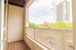 Tempe apartment for rent - a balcony with a large window and a view of a building
