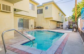 Valley Village apartment for rent - a swimming pool in front of a house