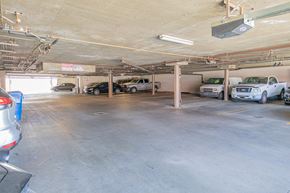 Panorama City apartment for rent - a parking garage with cars parked in it