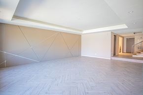 Panorama City apartment for rent - a large empty room with white walls and a wooden floor