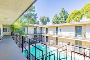 N. Hollywood apartment for rent - a balcony with a pool and a building with trees
