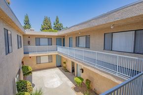 Canoga Park apartment for rent - the outlook of a building with balconies and a courtyard