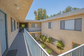 Canoga Park apartment for rent - the outlook of a building with a long balcony and a courtyard