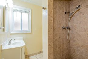 Long Beach apartment for rent - a bathroom with a shower and a sink and a window