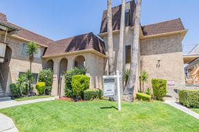 Canoga Park apartment for rent - a house with a sign in front of a lawn