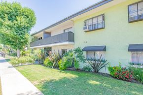 Winnetka apartment for rent - a yellow house with a garden in front of it