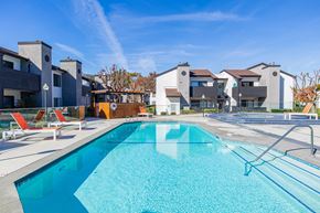 Long Beach apartment for rent - our apartments have a large swimming pool with apartments in the background