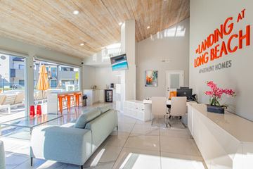 Long Beach apartment for rent - a living room with couches and a table with chairs