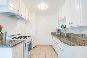 Winnetka apartment for rent - a kitchen with white appliances and granite counter tops