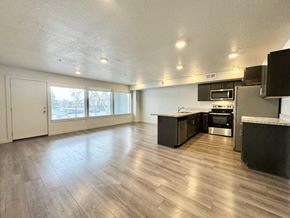 Millcreek apartment for rent - an empty kitchen and living room with a wood floor