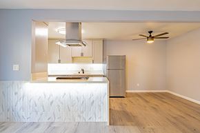 Sherman Oaks apartment for rent - a kitchen with a white counter top and a stainless steel refrigerator