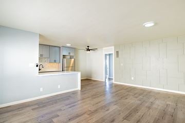 Santa Monica apartment for rent - A kitchen with a white counter and a fan on the ceiling.