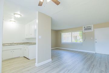 Northridge apartment for rent - A kitchen with white cabinets and a countertop is shown.