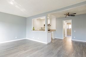 Valley Village apartment for rent - A room with a ceiling fan and a long wooden floor.