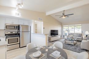 Phoenix apartment for rent - A modern kitchen with a dining table set for two.