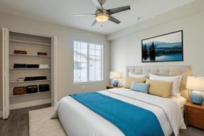Phoenix apartment for rent - a bedroom with a large bed and a ceiling fan