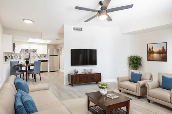 Phoenix apartment for rent - a living room with couches and a table with a tv