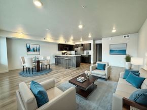 Millcreek apartment for rent - a living room and kitchen in a modern apartment