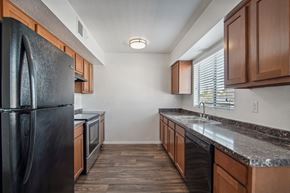 Glendale apartment for rent - the kitchen of our studio apartment atrium with stainless steel appliances and wooden cabinets