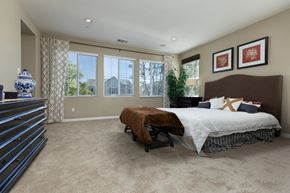 Buena Park apartment for rent - a master bedroom with a large bed and a dresser
