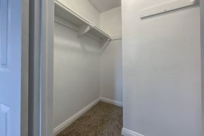 Buena Park apartment for rent - a closet in a bedroom with a white wall and carpet