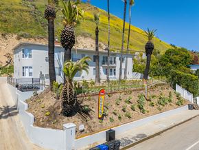 Malibu apartment for rent - A white house with a garden in front of it.