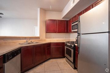 El Paso apartment for rent - a kitchen with stainless steel appliances and wooden cabinets