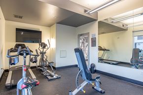 Tempe apartment for rent - a gym with treadmills and other exercise equipment at the belgard apartments