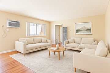 Canoga Park apartment for rent - A living room with two couches, a coffee table, and a painting on the wall.