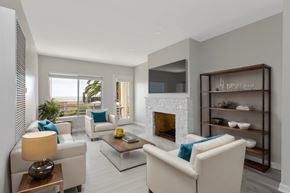 Malibu apartment for rent - A modern living room with a fireplace and a flat screen TV.