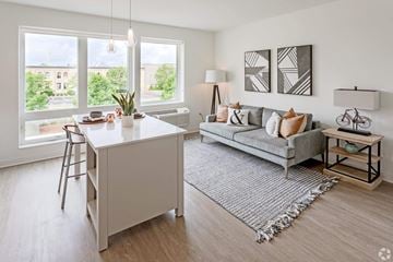 Minneapolis apartment for rent - a living room with a couch and a kitchen