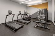 Minneapolis apartment for rent - a gym with cardio equipment and weights in a building