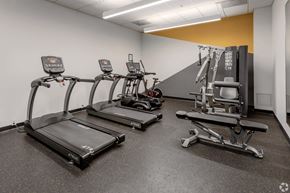Minneapolis apartment for rent - a gym with cardio equipment and weights in a building