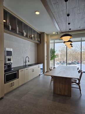 Hopkins apartment for rent - A modern kitchen with a large island and wooden cabinets.