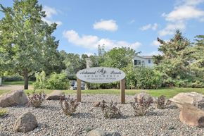 Woodbury apartment for rent - A sign that says "Shadow Ponds" stands in front of a house.