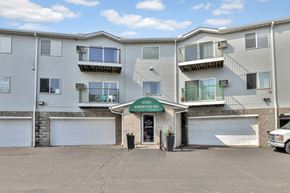 Woodbury apartment for rent - A building with the sign "6725 Ashwood Rd." is shown.