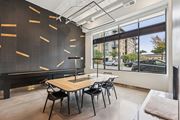 Minneapolis apartment for rent - A room with a pool table and a view of the street outside.