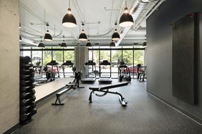 St. Paul apartment for rent - a gym with weights machines and a window
