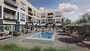 Wayzata apartment for rent - A swimming pool is surrounded by lounge chairs and umbrellas in a courtyard.