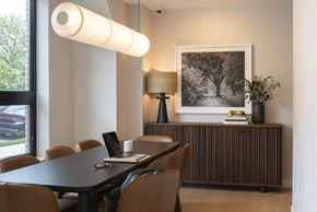 Minneapolis apartment for rent - A modern dining room with a black table and chairs.