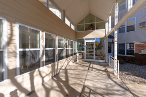 Mounds View apartment for rent - A sunny day at the outdoor seating area of a building.