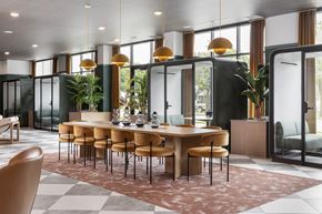 St Paul apartment for rent - A modern dining room with a large table and chairs.