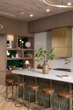St Paul apartment for rent - A kitchen with a white counter and brown stools.