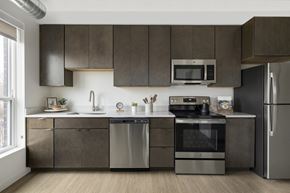 St. Paul apartment for rent - a kitchen with dark cabinets and stainless steel appliances