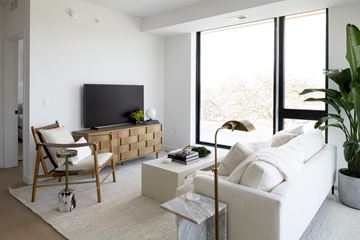 Minneapolis apartment for rent - a living room with a white couch and a television