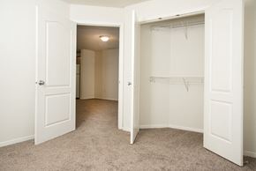 Maplewood townhouse for rent - an empty bedroom with a closet and a white closet door