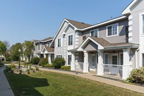 Maplewood townhouse for rent - A row of houses with white and grey exteriors.