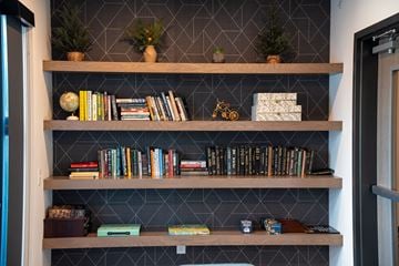 St. Paul apartment for rent - A bookshelf filled with books and decorative items.