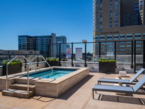 Minneapolis apartment for rent - the pool on the rooftop of a building with a city in the background